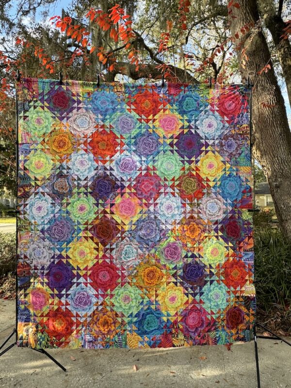 Shimmering Triangles Quilt Kit featuring Kaffe Fassett