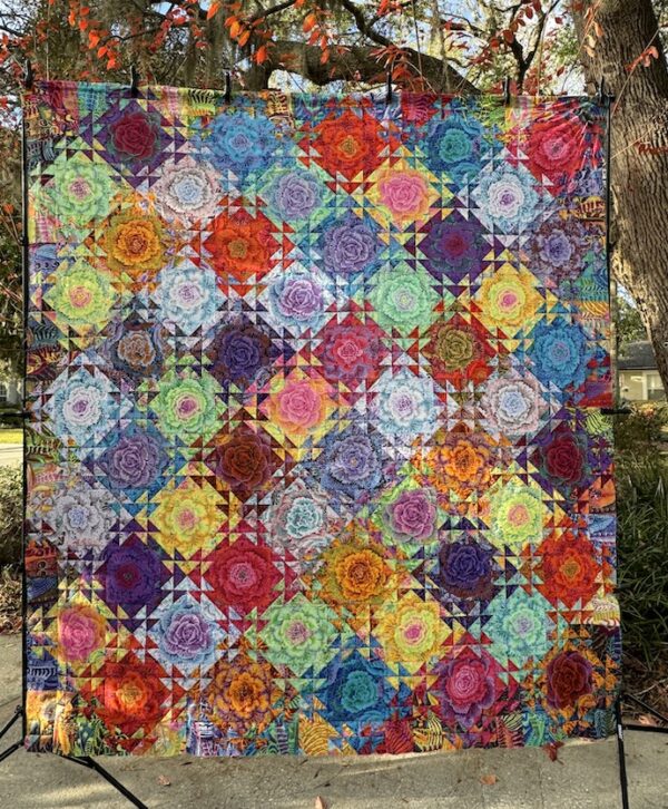 Shimmering Triangles Quilt Kit featuring Kaffe Fassett